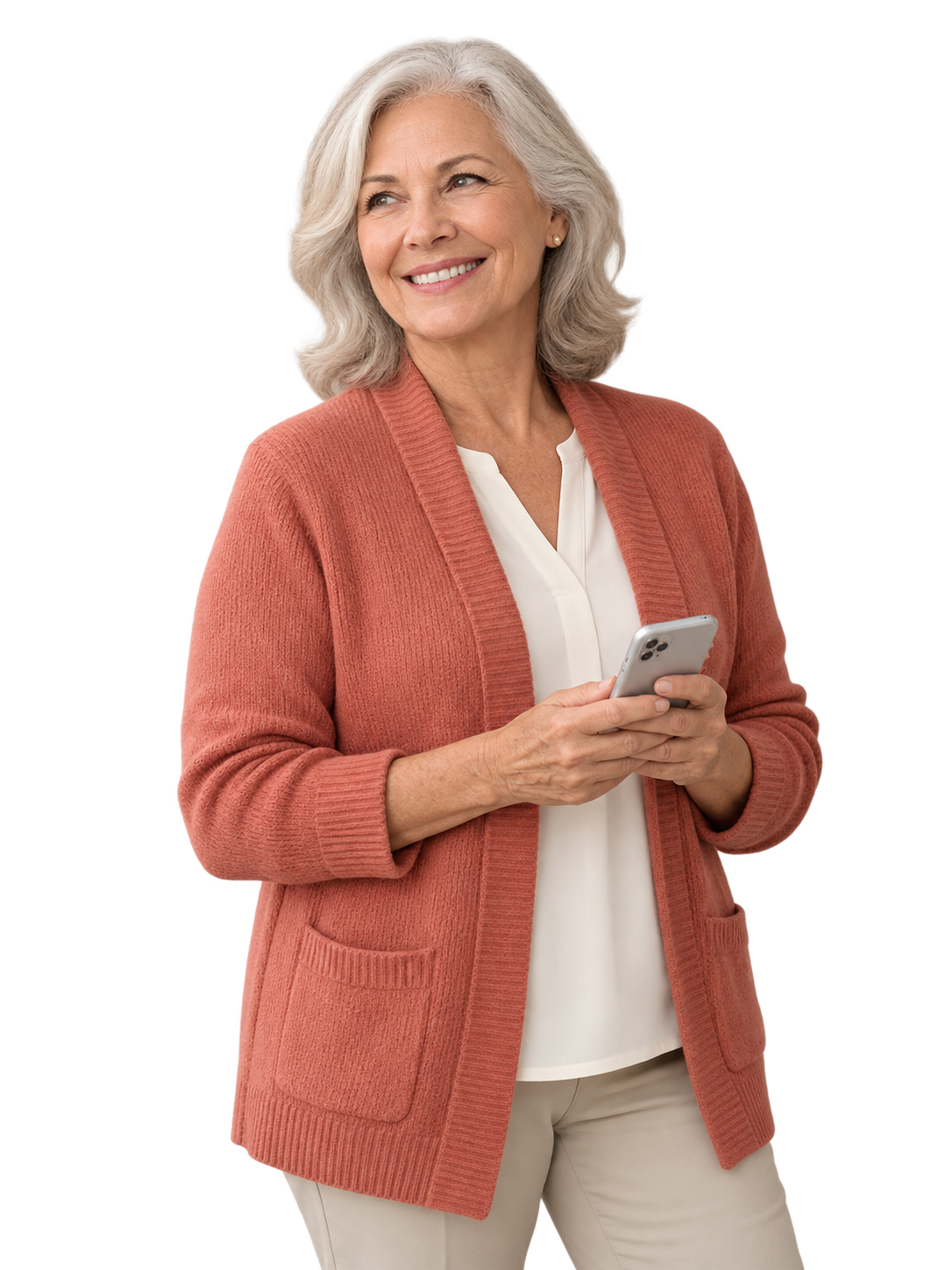 Woman in her sixties smiling, phone in hand